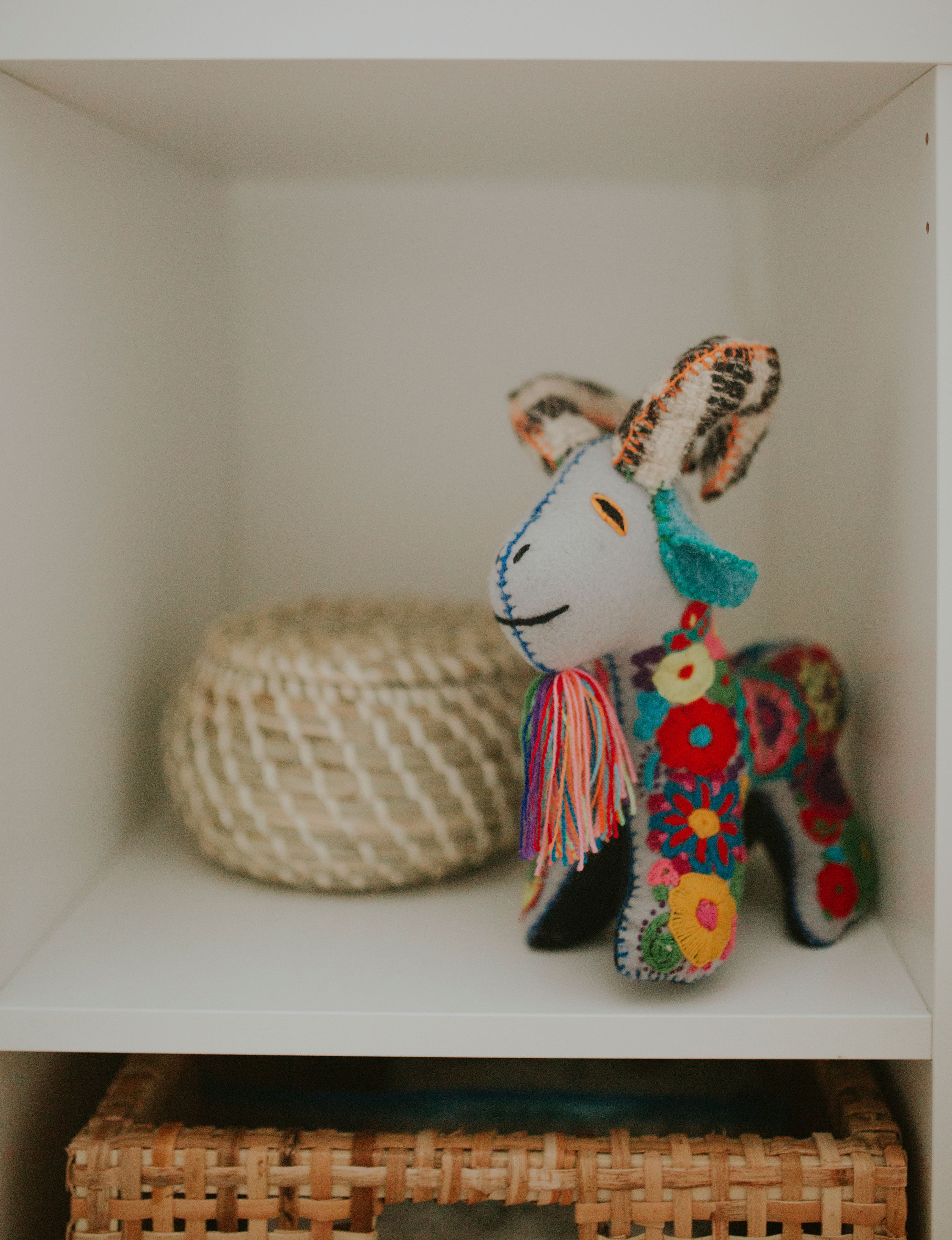 Stuffed animal handmade from artisan on IKEA Kallax bookcase