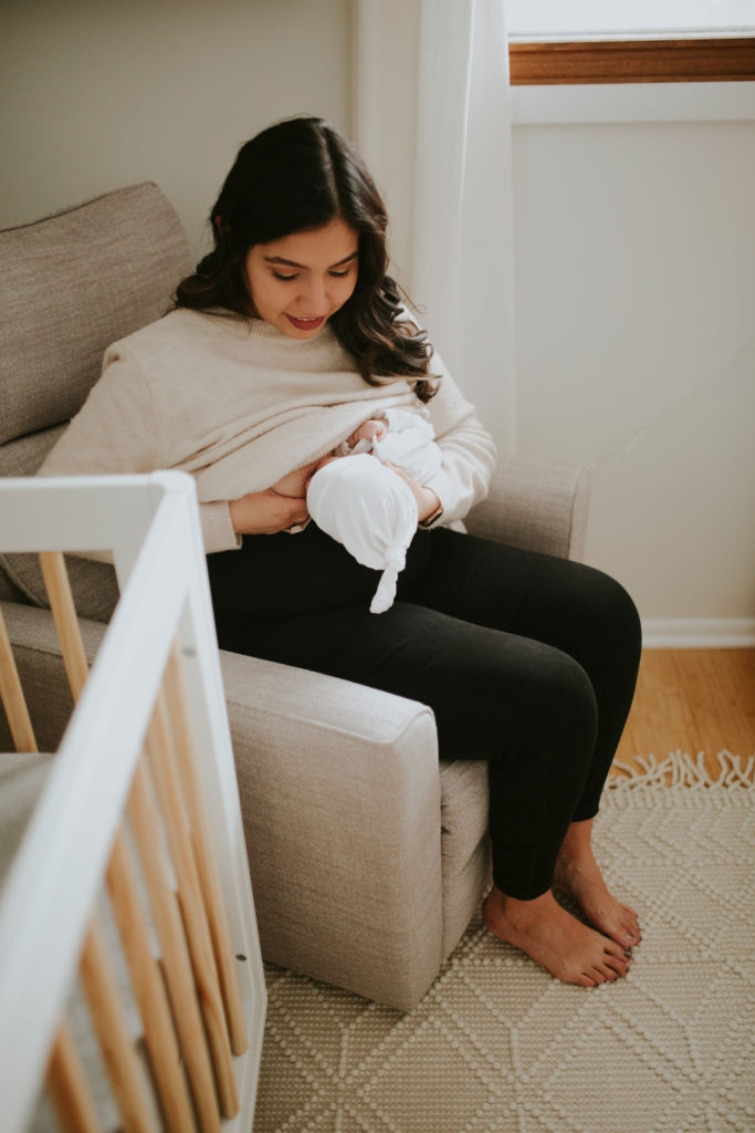 Latina mother breastfeeding newborn baby